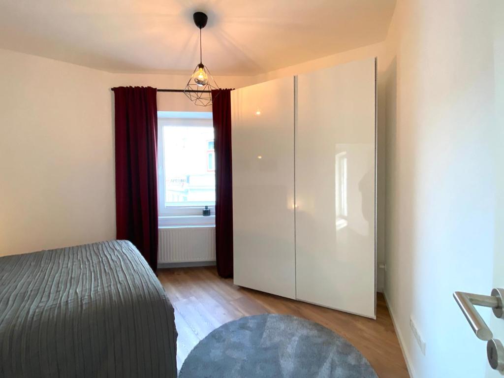 Posteľ alebo postele v izbe v ubytovaní White Inn - Ferienwohnung mit Terrasse