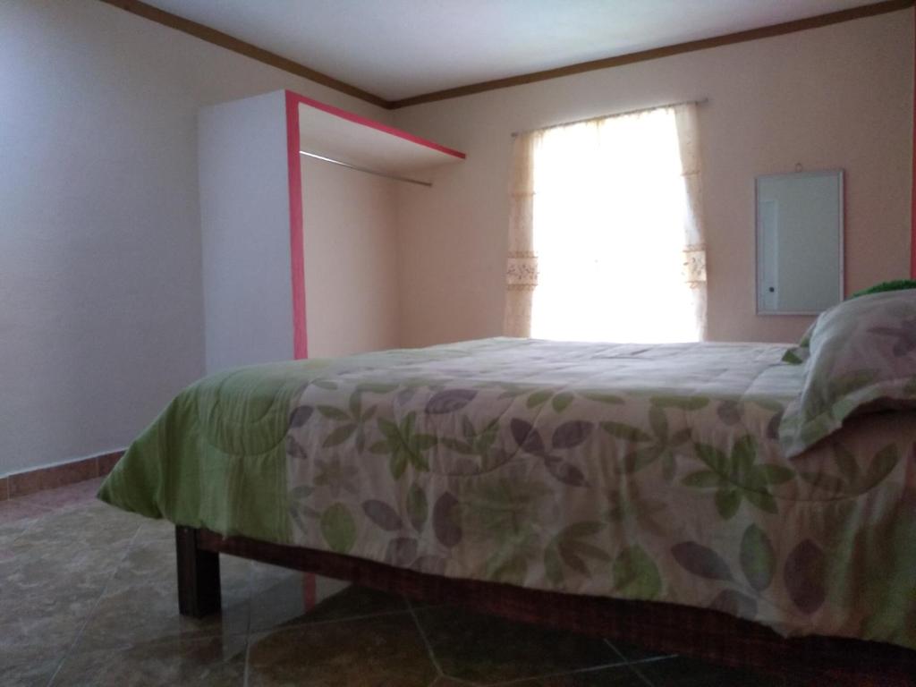 Postel nebo postele na pokoji v ubytování Casa GoEs