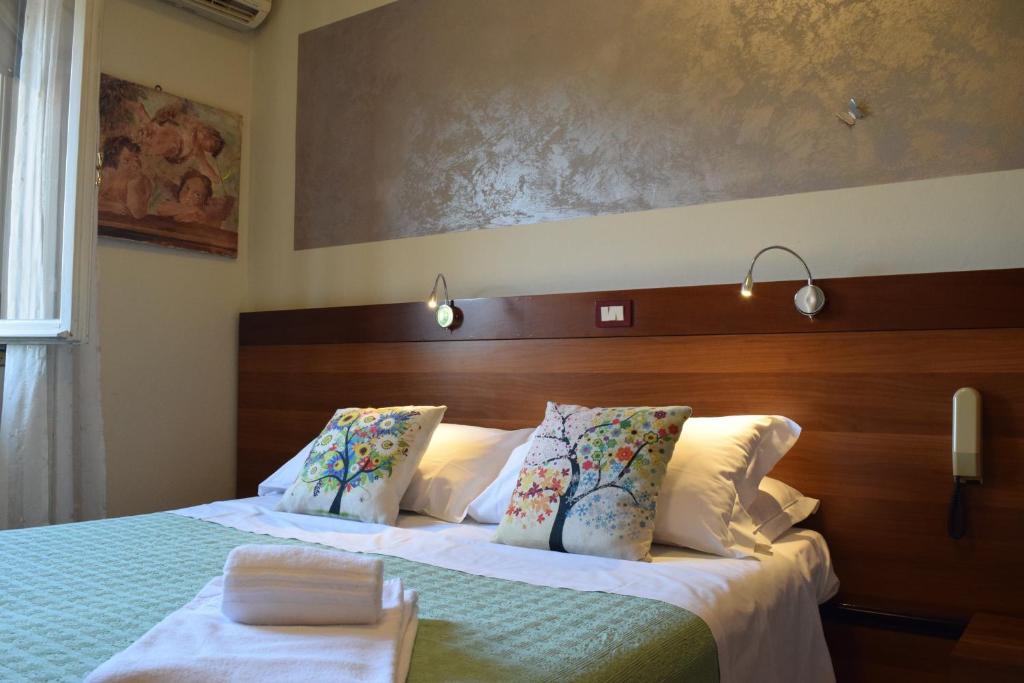 Posteľ alebo postele v izbe v ubytovaní Albergo Trattoria Fioravante