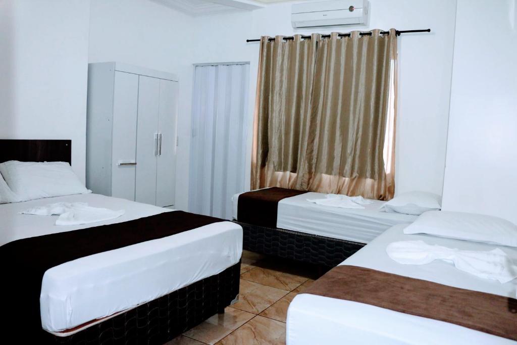Postel nebo postele na pokoji v ubytování Hotel Edinik