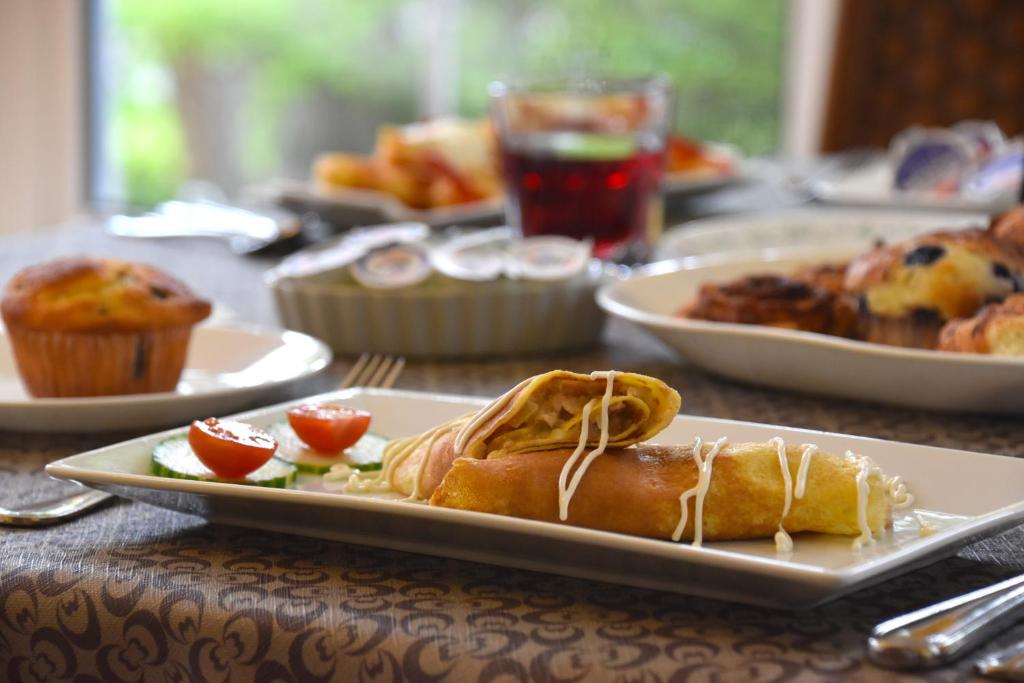 a table with plates of food on a table at The Harbour House in Charlottetown
