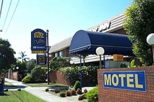a motel sign in front of a motel at Hume Villa Motor Inn in Melbourne