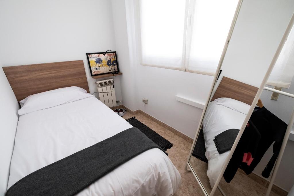 Posteľ alebo postele v izbe v ubytovaní Bravissimo Home & Bike Girona