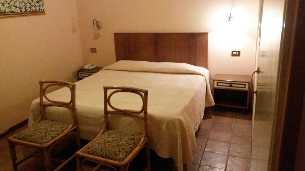 Postel nebo postele na pokoji v ubytování Albergo Ristorante Ferretti