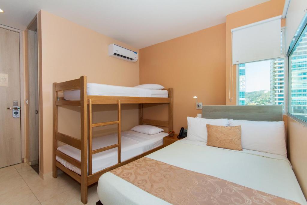 Postel nebo postele na pokoji v ubytování Hotel Aixo Suites By GEH Suites