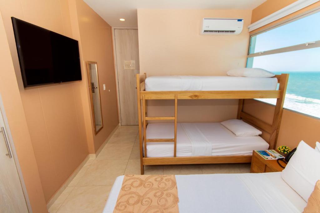 Postel nebo postele na pokoji v ubytování Hotel Aixo Suites By GEH Suites