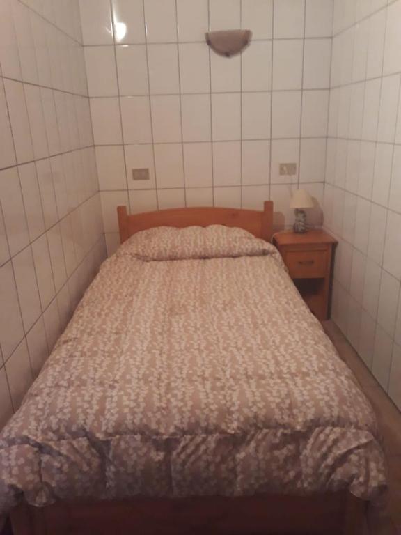 Postel nebo postele na pokoji v ubytování Apart Hotel Dolce Vita