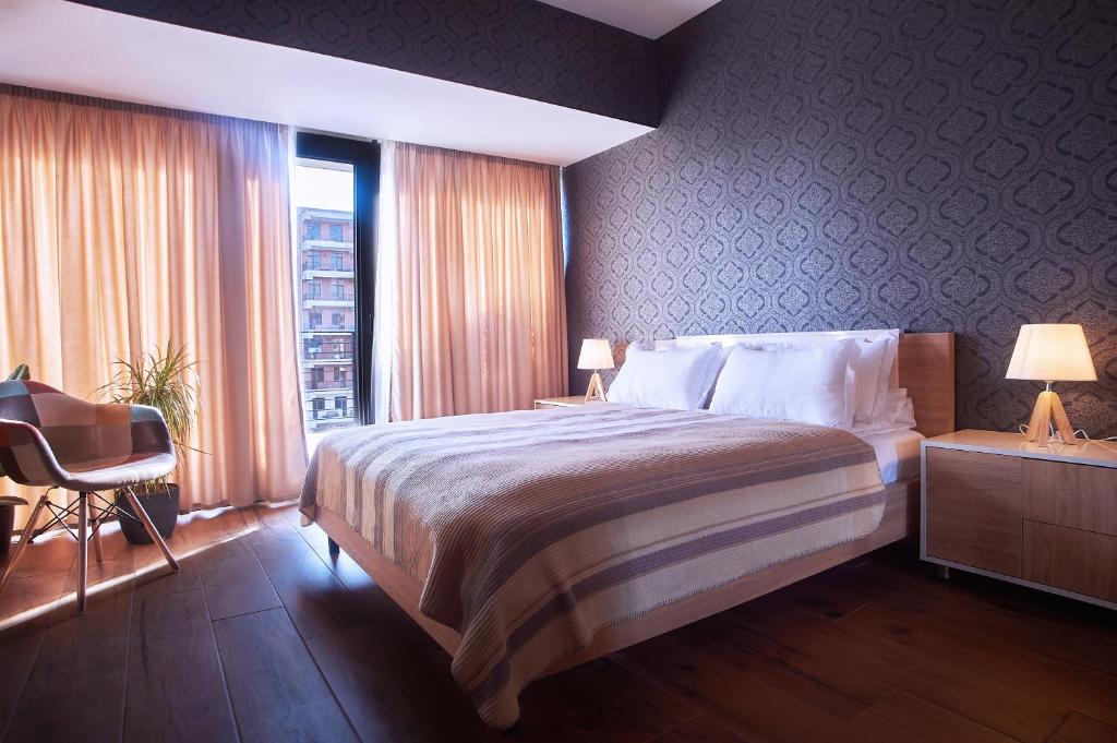 Postel nebo postele na pokoji v ubytování Green Boutique Hotel