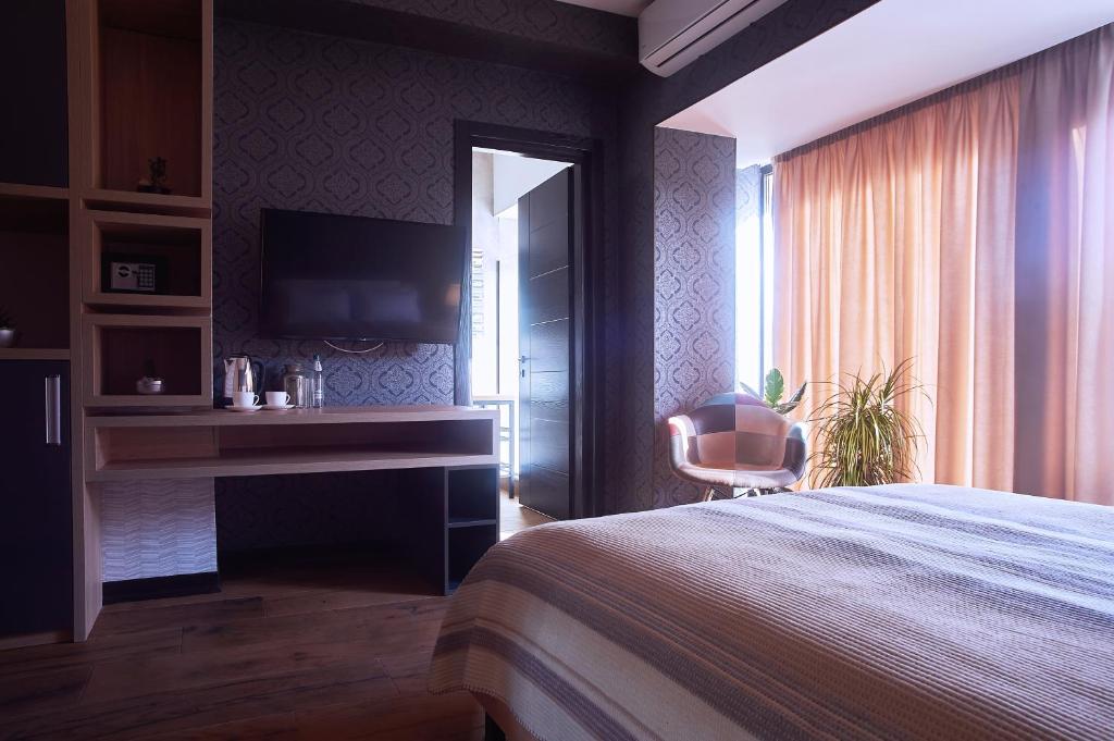 Postel nebo postele na pokoji v ubytování Green Boutique Hotel