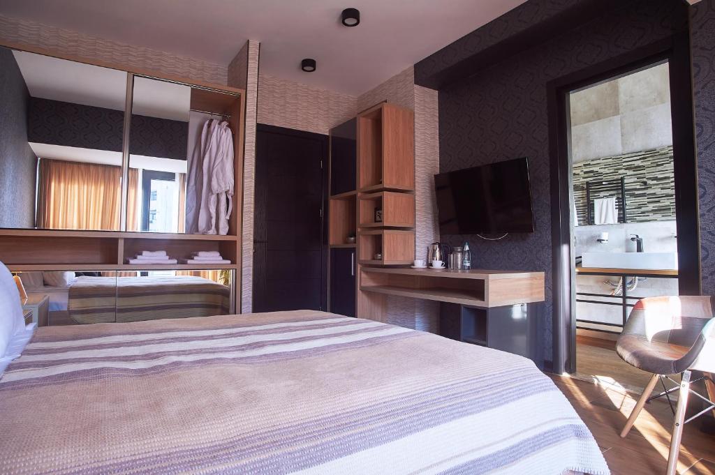 Postel nebo postele na pokoji v ubytování Green Boutique Hotel