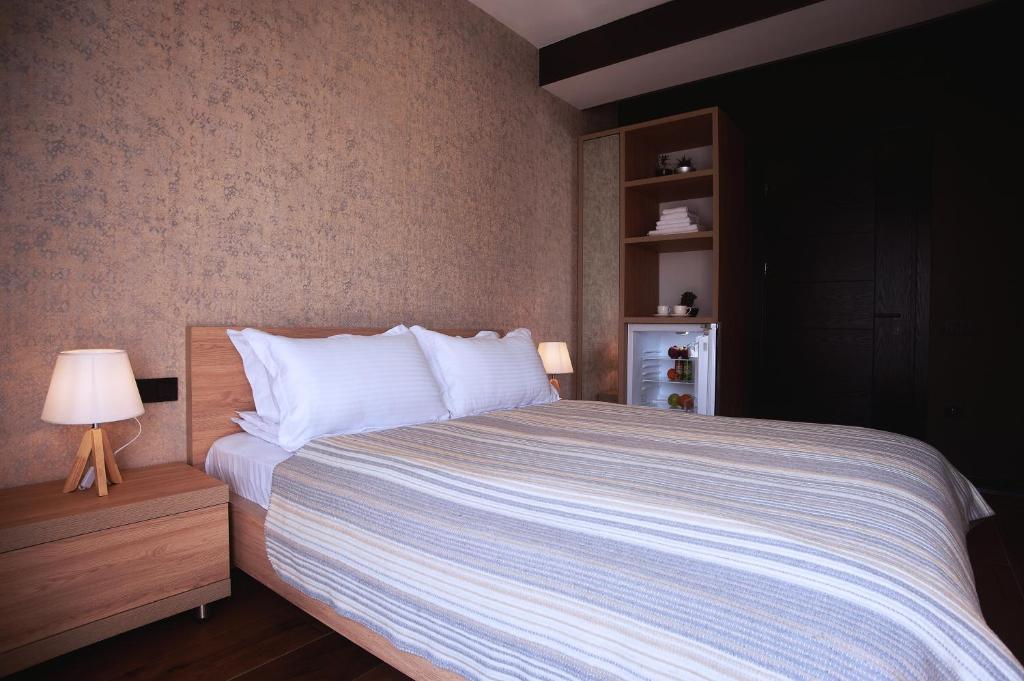 Postel nebo postele na pokoji v ubytování Green Boutique Hotel