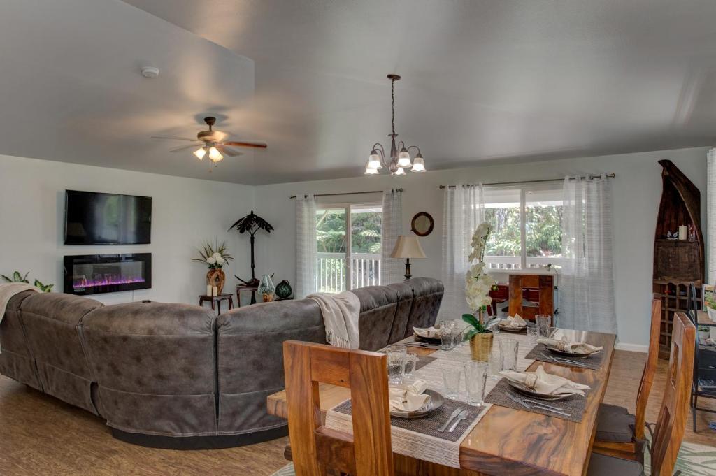 a living room with a couch and a table at Ferns & Frogs Forest Hale home in Mountain View