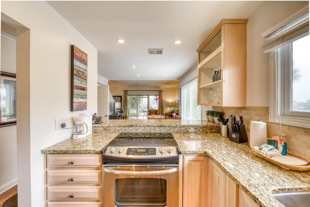 a kitchen with a stove and a counter top at Mariner's Walk 8-A in Isle of Palms