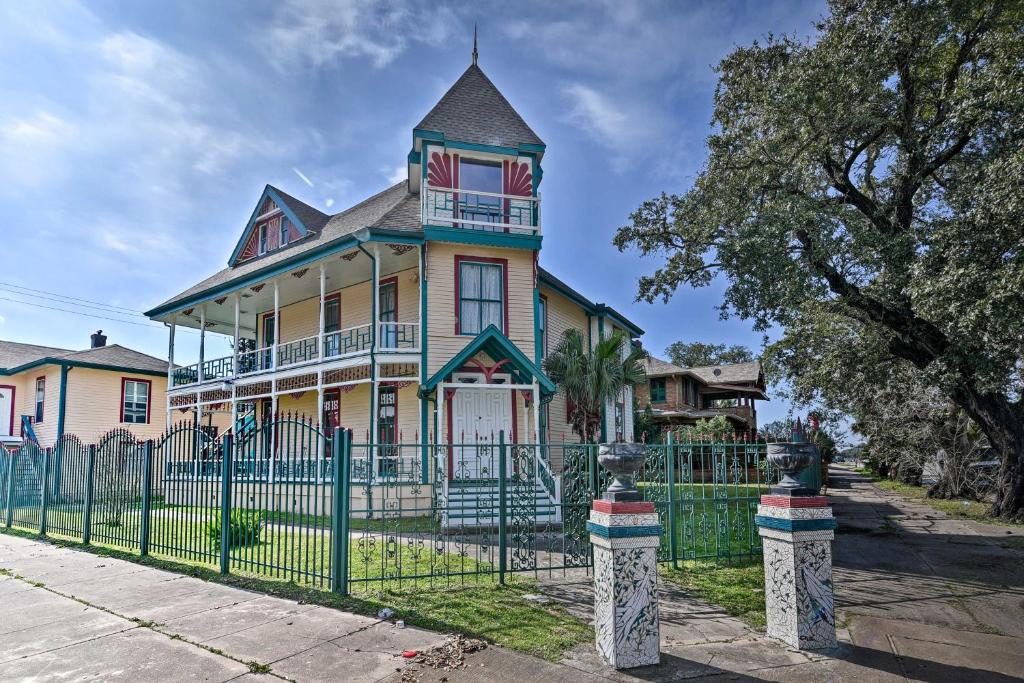 an old house with a fence in front of it at 1 Mi to Beach Group-Friendly Galveston Home! in Galveston