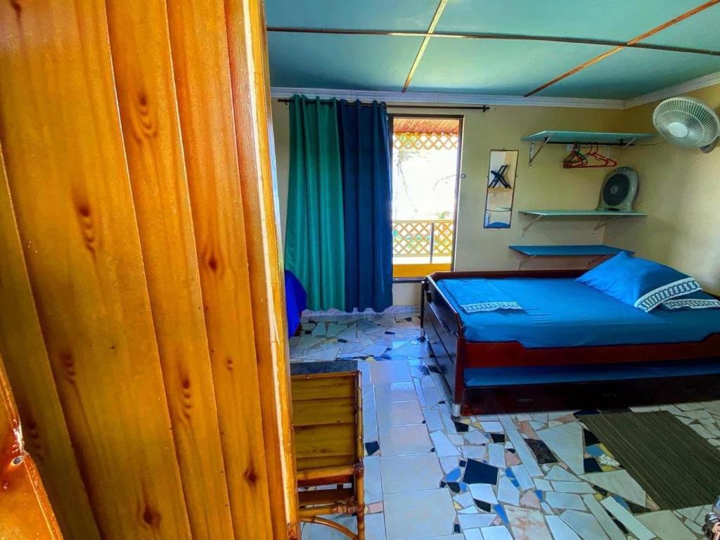 Postel nebo postele na pokoji v ubytování Yellow Moon Guesthouse & Apartments