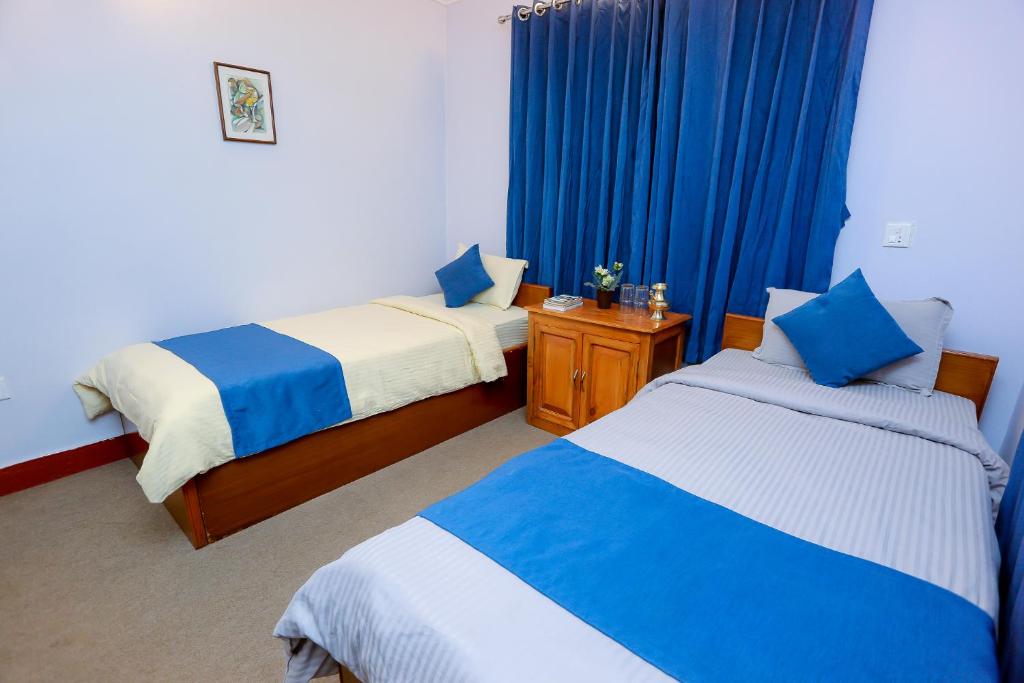 Krevet ili kreveti u jedinici u okviru objekta Gaurishankar Backpackers hostel