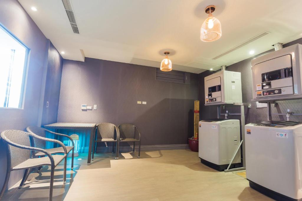 Kuchyň nebo kuchyňský kout v ubytování FX Hotel Tainan
