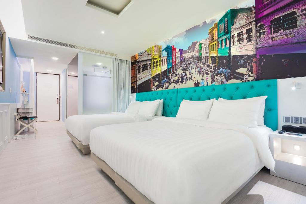 Postel nebo postele na pokoji v ubytování FX Hotel Tainan
