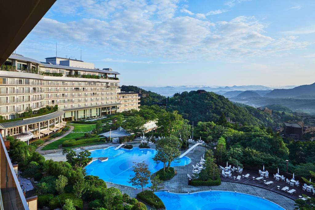 an aerial view of a hotel with two swimming pools at Arima Grand Hotel in Kobe