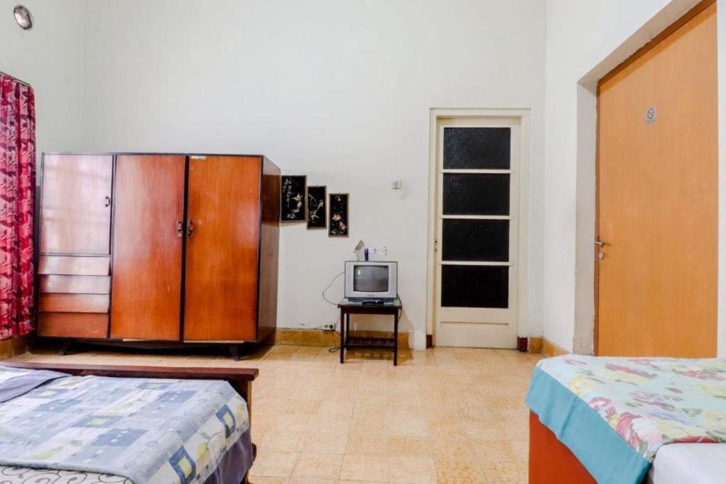 Postel nebo postele na pokoji v ubytování Hotel Sumaryo