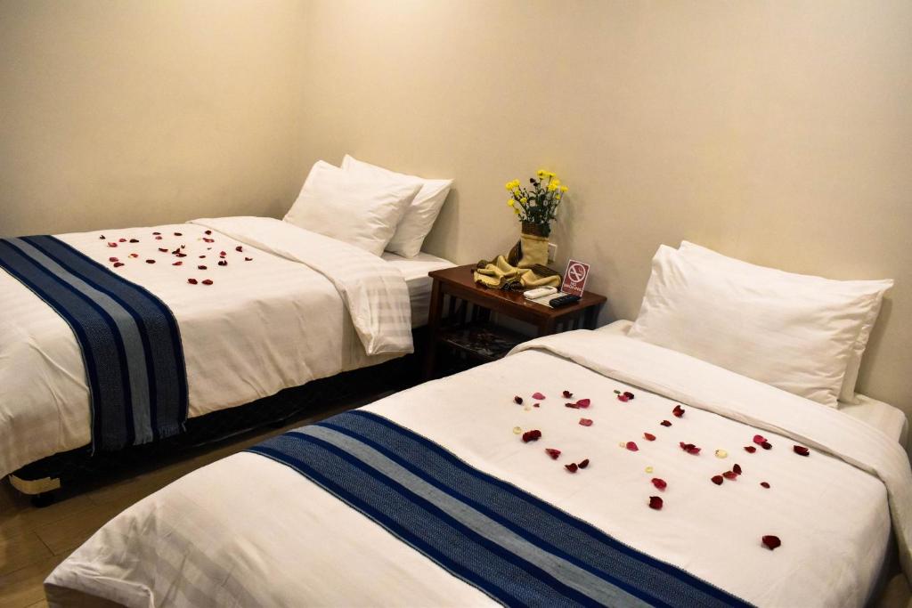 Postel nebo postele na pokoji v ubytování Hotel Lourdes