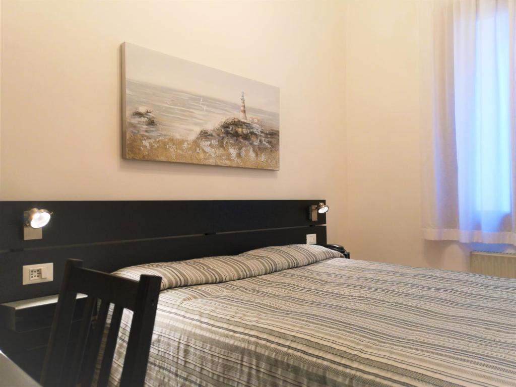 Postel nebo postele na pokoji v ubytování Hotel Rossi