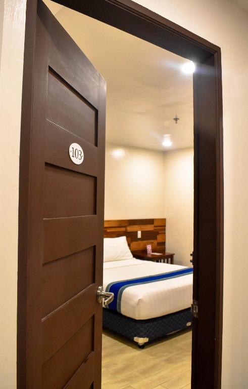 Postel nebo postele na pokoji v ubytování Hotel Lourdes
