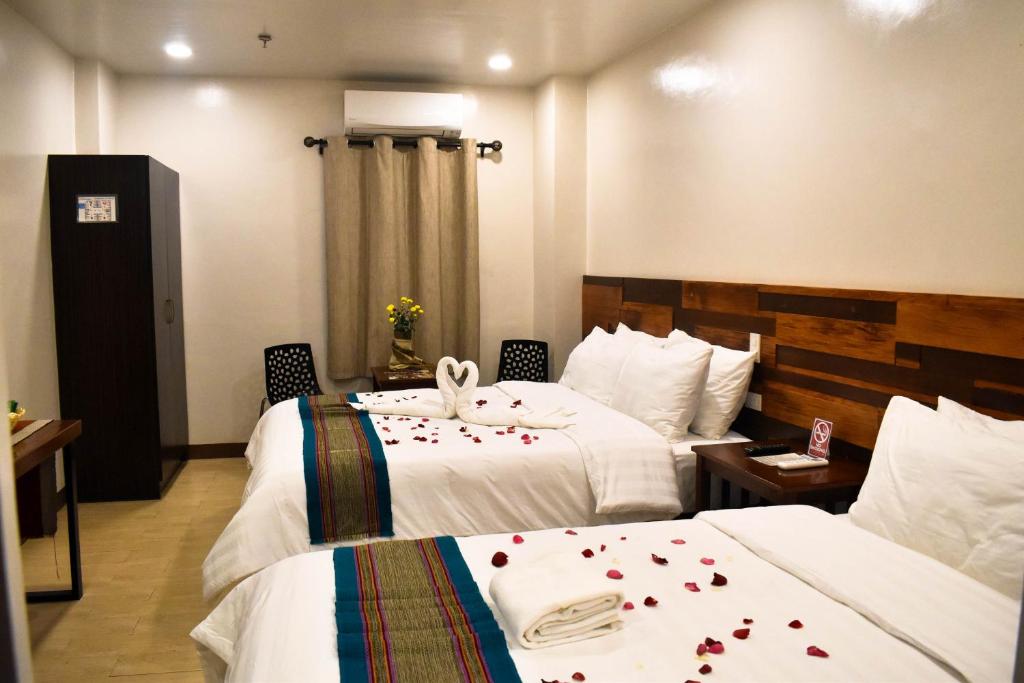 Postel nebo postele na pokoji v ubytování Hotel Lourdes