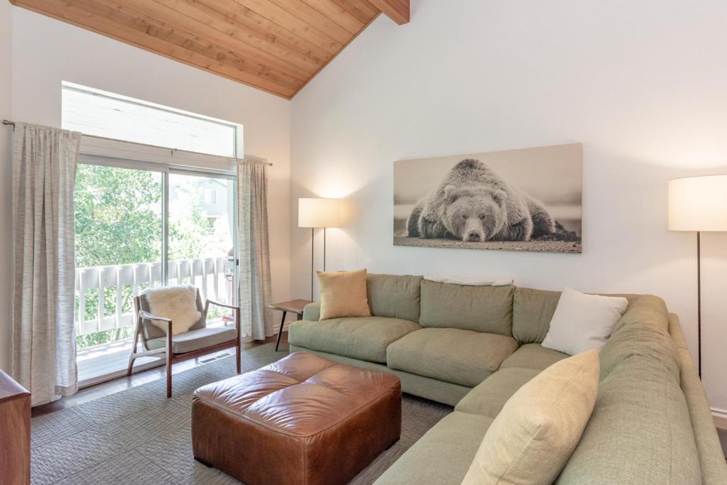 a living room with a couch and a table at Snowcreek IV 550 in Mammoth Lakes