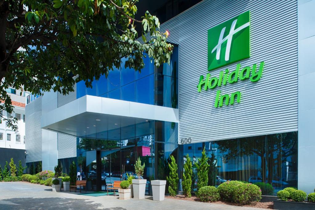 an office building with a sign on the front of it at Holiday Inn Belo Horizonte Savassi, an IHG Hotel in Belo Horizonte