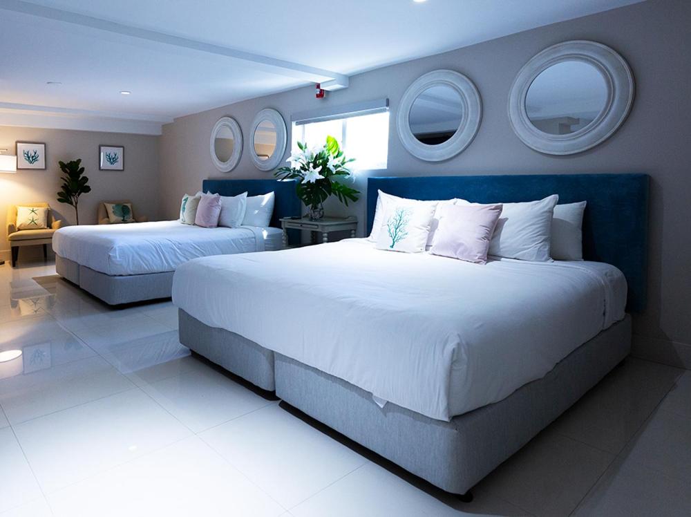 a large white bed in a room at Hotel Harrison in Miami Beach