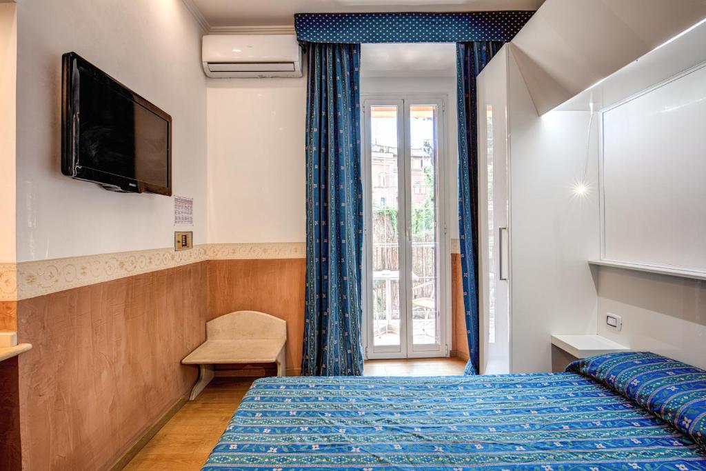 Posteľ alebo postele v izbe v ubytovaní Hotel Verona Rome
