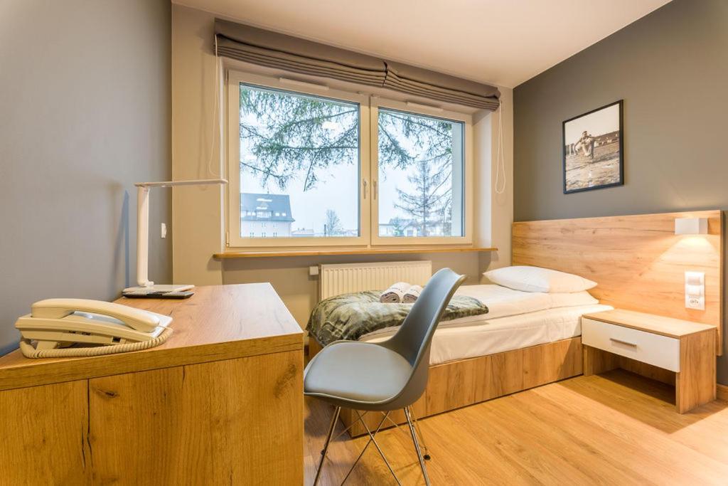 Posteľ alebo postele v izbe v ubytovaní Hotel***Gorce