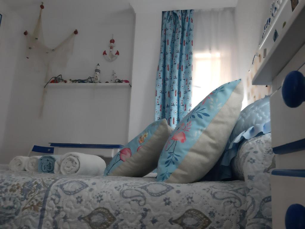 Postel nebo postele na pokoji v ubytování La Casa de La Abuela Rosy