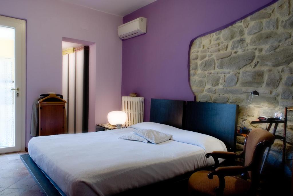 Cama o camas de una habitación en Lo Squero Rooms and Apartments