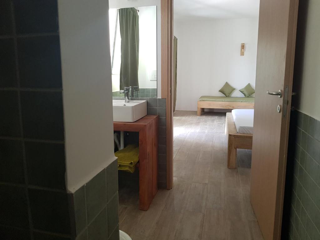 Postel nebo postele na pokoji v ubytování La Base Hotel