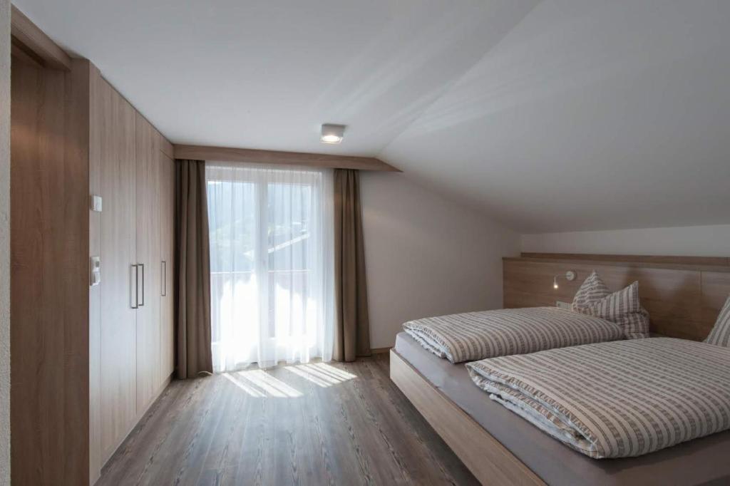 Postel nebo postele na pokoji v ubytování Haus Pipperger