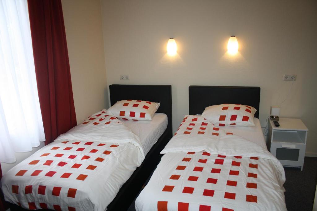 Postel nebo postele na pokoji v ubytování Hotel Café Restaurant Snackbar Beerzerveld
