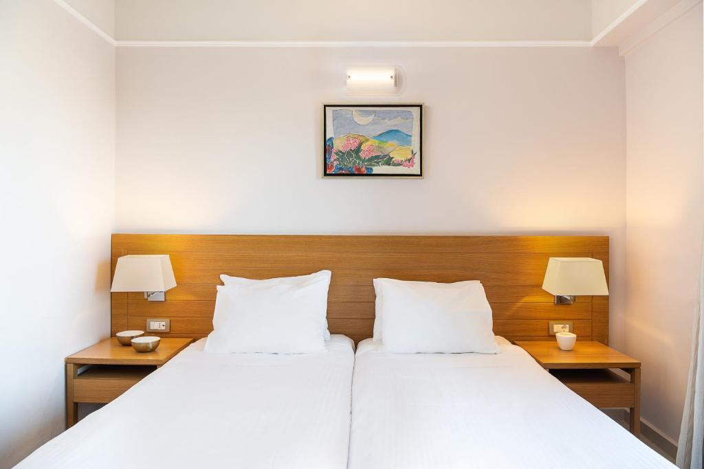 Postel nebo postele na pokoji v ubytování Porto Platanias Village Resort