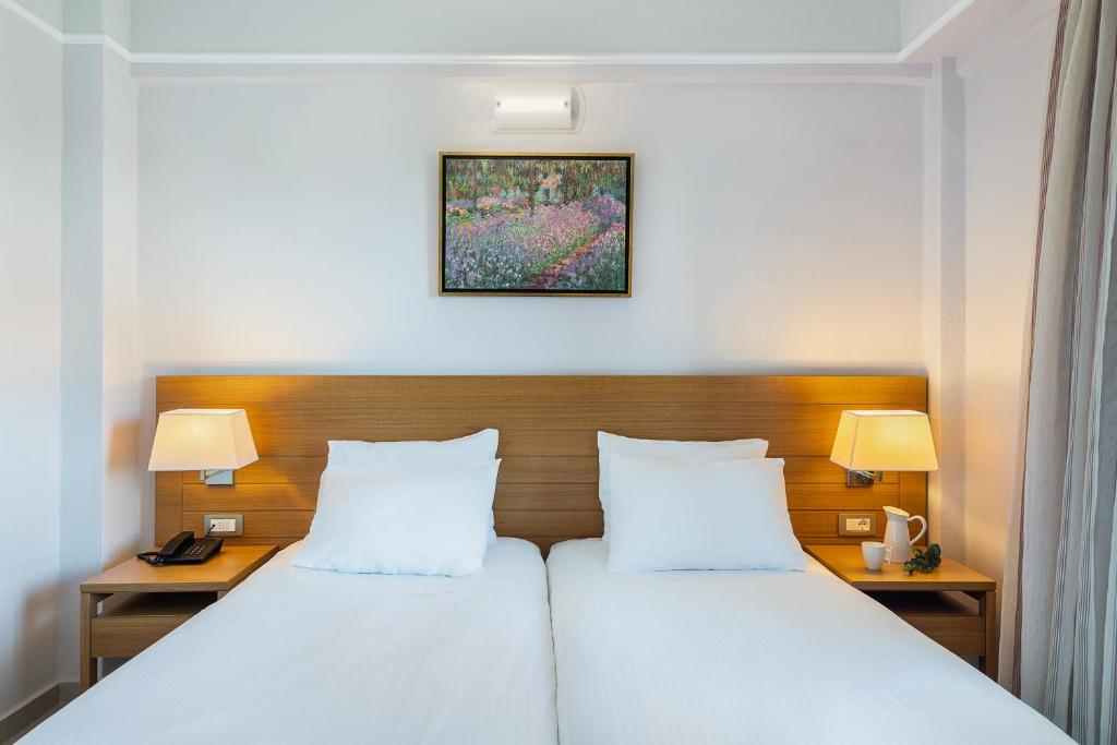 Postel nebo postele na pokoji v ubytování Porto Platanias Village Resort