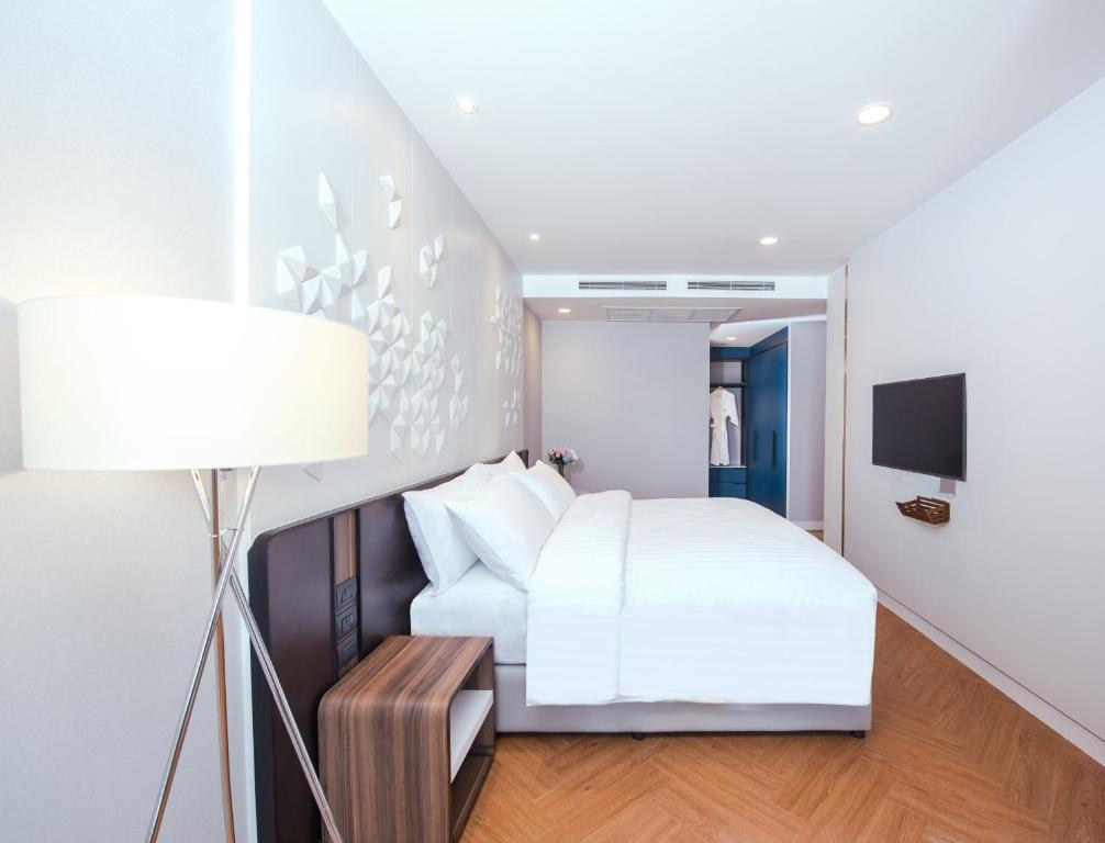 Postel nebo postele na pokoji v ubytování Amanta Hotel & Residence Sathorn