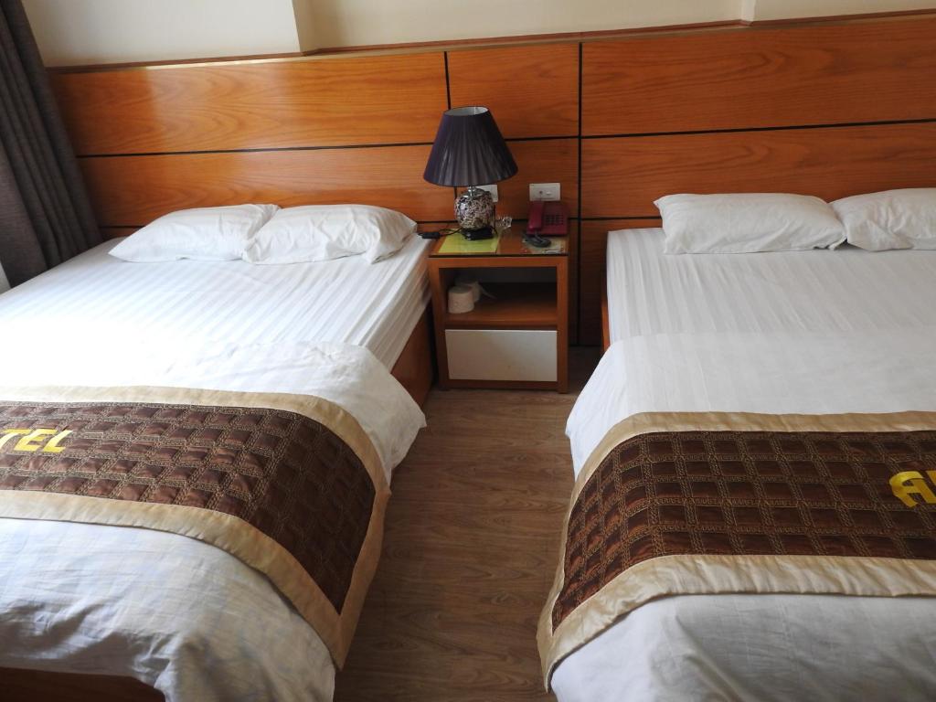 Postel nebo postele na pokoji v ubytování An Phú Nguyễn Hoàng Hotel