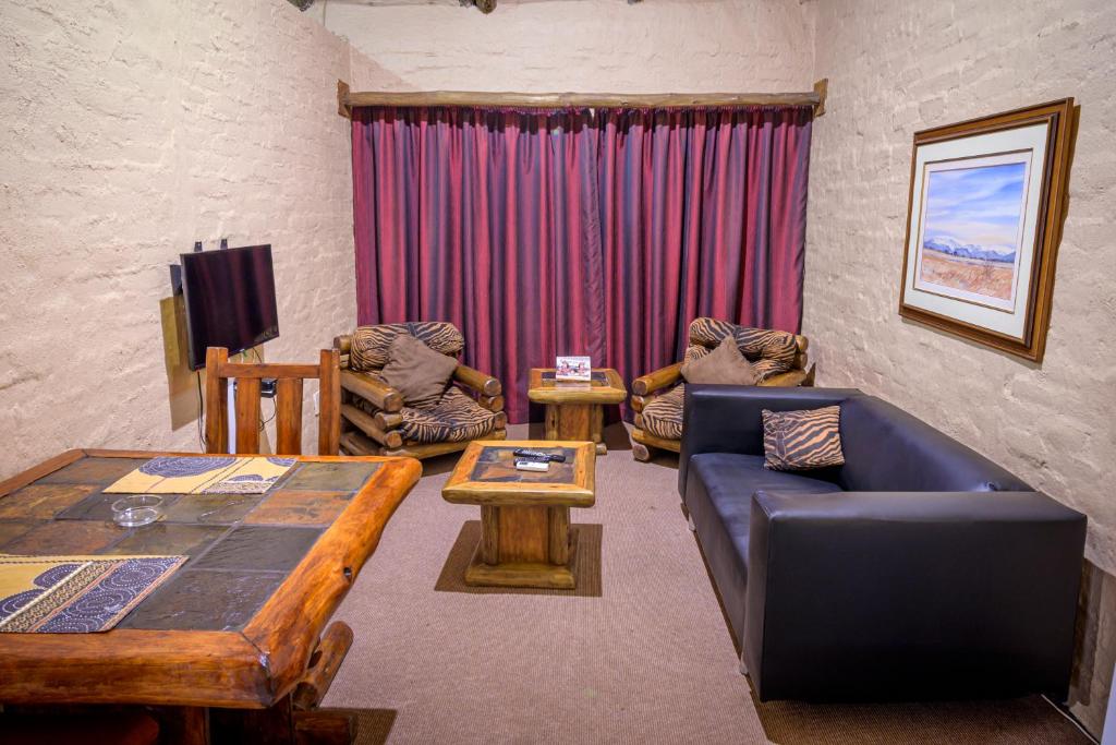 Χώρος καθιστικού στο Bains Lodge
