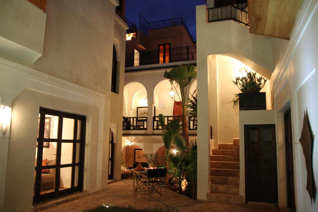 a courtyard of a house at night at Riad Spa Dar Nimbus in Marrakech