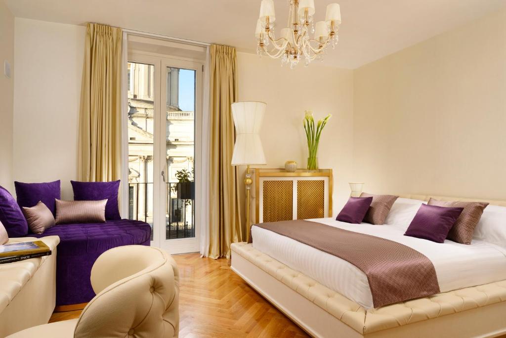 Cama ou camas em um quarto em Lifestyle Suites Rome