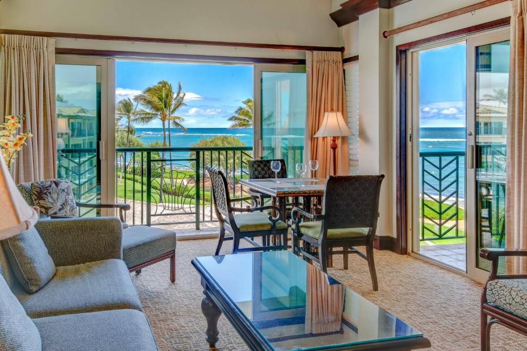 a living room with a view of the ocean at Hale Tiare condo in Kapaa