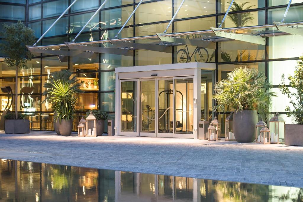 a building with plants in front of it at INNSiDE by Meliá Milano Torre GalFa in Milan