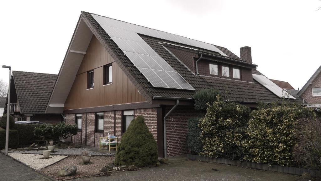 a house with solar panels on the roof at Grenzgänger in Gronau