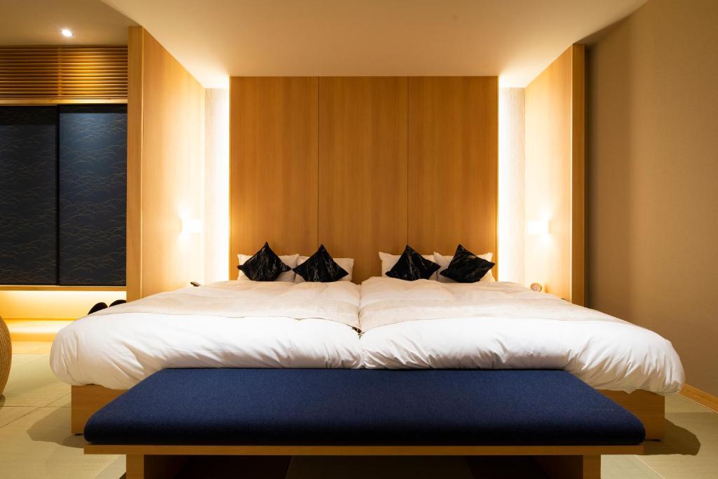 Postel nebo postele na pokoji v ubytování FIRSTCABIN Kyoto Nijojo