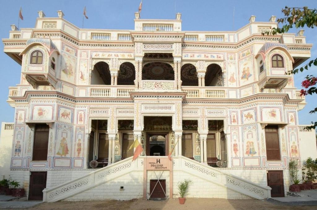 a large white building with ornate architecture at Hotel Heritage Mandawa in Mandāwa